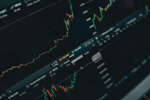 Close-up of stock market trading screen displaying financial growth and charts.